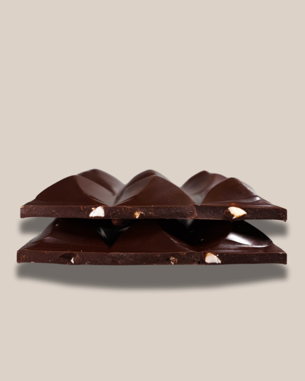 Close-up of chocolate texture with roasted hazelnuts and coffee grounds